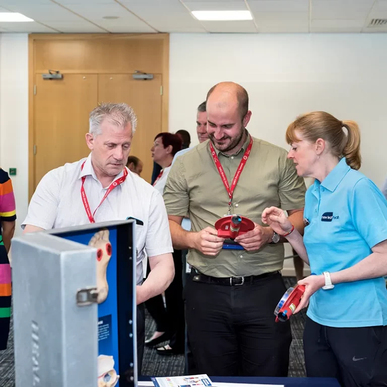 Attendees engage with a physical health zone in a wellbeing roadshow