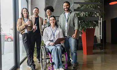 A diverse group of workplace wellbeing champions posing for a photo