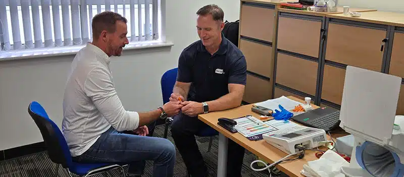 An employee at PR Offshore engaging in a health screening appointment with a New Leaf Health practitioner