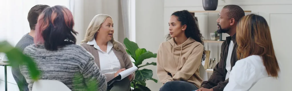 A group of employees engaging in a session for Mental Health First Aid in the Workplace