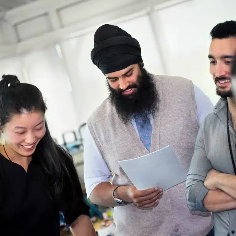 A diverse group of 3 employees taking part in a workplace health check day