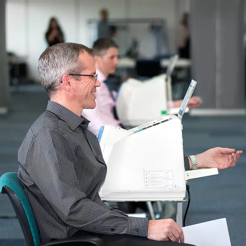 A man getting a blood pressure test as part of an employee health screening