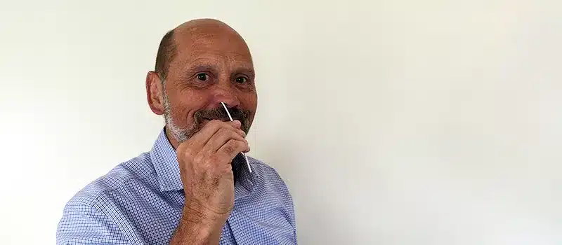 Andy Lee-O'Neil using a Flowflex COVID test swab