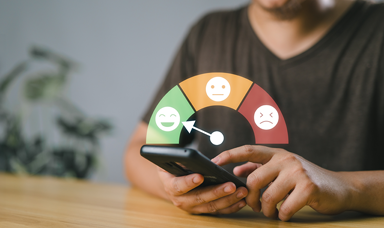 An employee taking an employee wellbeing survey on their phone, with a faces graphic superimposed
