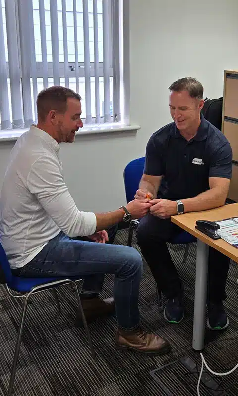 An employee at PR Offshore engaging in an employee health screening