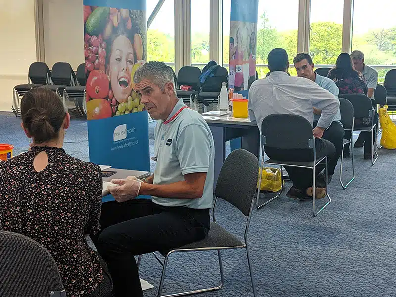 An employee health screening event where attendees are retesting themselves