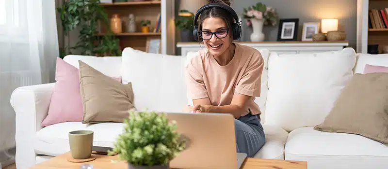 How many mental health first aiders do you need at work - a remotely working mental health first aider talking with a colleague on their laptop