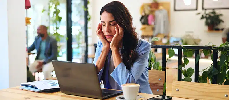 A woman experiencing menopause and mental health at work symptoms